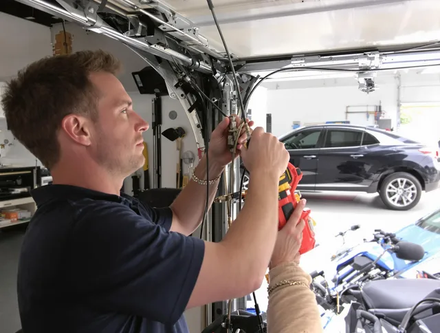 Upland Garage Door Repair safety certified technician performing cable replacement in Upland