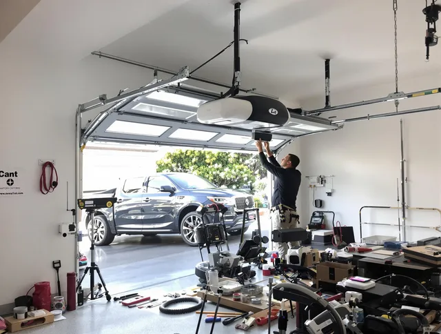 Upland Garage Door Repair specialist installing smart garage door opener system in Upland home
